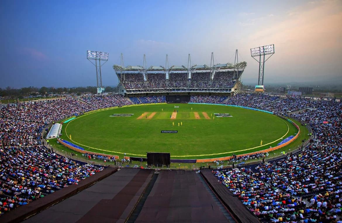 A towering view of the MCA Cricket Stadium in Pune under the bright floodlights during an IPL match.